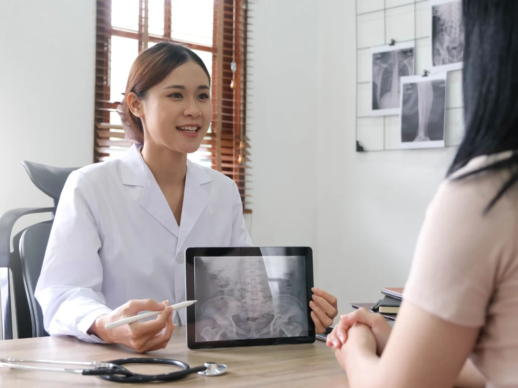 Doctor explaining a bone density scan during a health screening consultation